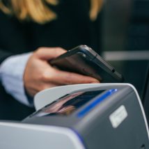 shallow focus photography of person holding smartphone